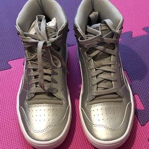Puma, high rise, metallic silver athletic shoe.